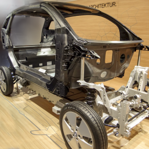 BMW i3 Carbon Fiber Frame auto show on brown background